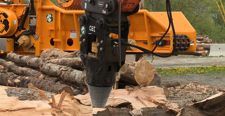 A Log and Stump Screw attachment is a highly efficient option for splitting oversized butt logs, pole wood, tree service block wood, and stumps into a more manageable size (photo courtesy CBI).