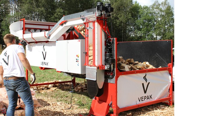 A Vepak firewood packing machine getting setup for a demonstration.
