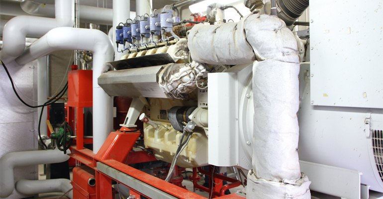 Heavy insulation and heat pumps capture radiant heat from the MAN genset.