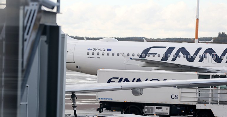Finnair aircraft being serviced at Helsinki airport in Finland. On January 15, 2019, the Finnish national carrier introduced carbon offsetting alternatives for its customers.