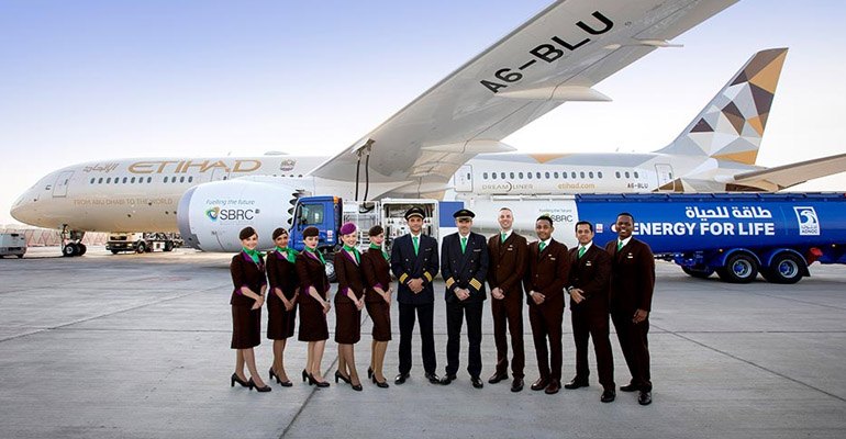 The Etihad crew pose for a photo on the tarmac at Abu Dhabi International airport ahead of the world's first flight using a biojet fuel made locally in the United Arab Emirates (photo courtesy Boeing).